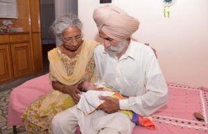 Indian parents Mohinder Singh Gill (R), 79, and Daljinder Kaur, 70, hold their newborn baby boy Arman at their home in Amritsar on May 11, 2016. An Indian woman who gave birth at the age of 70 said May 10 she was not too old to become a first-time mother, adding that her life was now complete. Daljinder Kaur gave birth last month to a boy following two years of IVF treatment at a fertility clinic in the northern state of Haryana with her 79-year-old husband. / AFP PHOTO / NARINDER NANU
